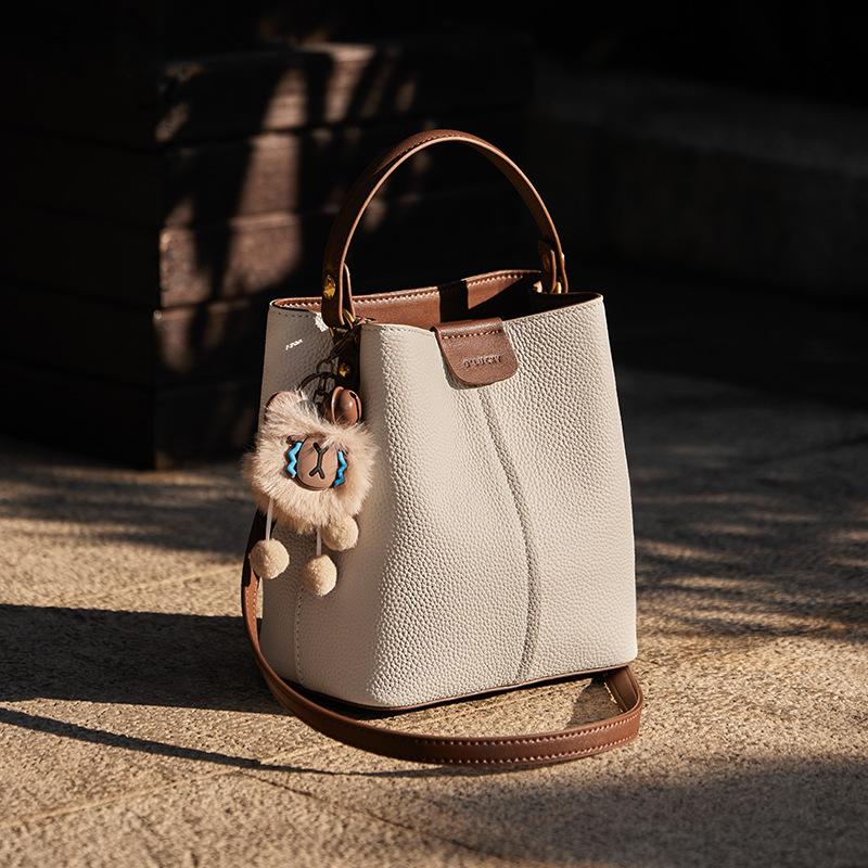 

Новая женская сумка 2025 Новый горячий стиль Модная ретро Коровья кожа Нишевый дизайн Сумка через плечо Универсальная ручная сумка-ведро Long18CM、Wide11CM、Hig