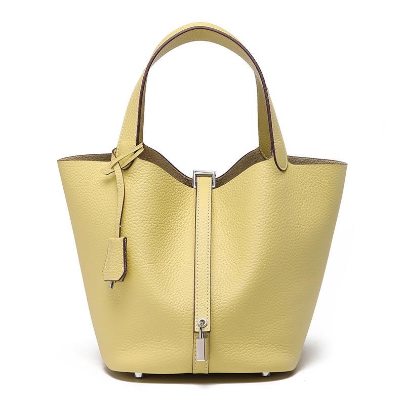 

Жіноча сумка-відро зі шкіри корови: Маленький, універсальний, преміальний для роботи або поїздок