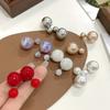 Versatile 925 Silver Pearl Bow Stud Earrings with Double-Sided Tassels