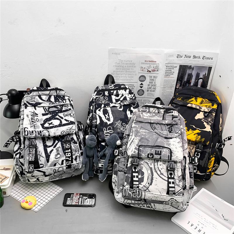 Autumn new fashion schoolbag female personality camouflage graffiti couple backpack large capacity student backpack male