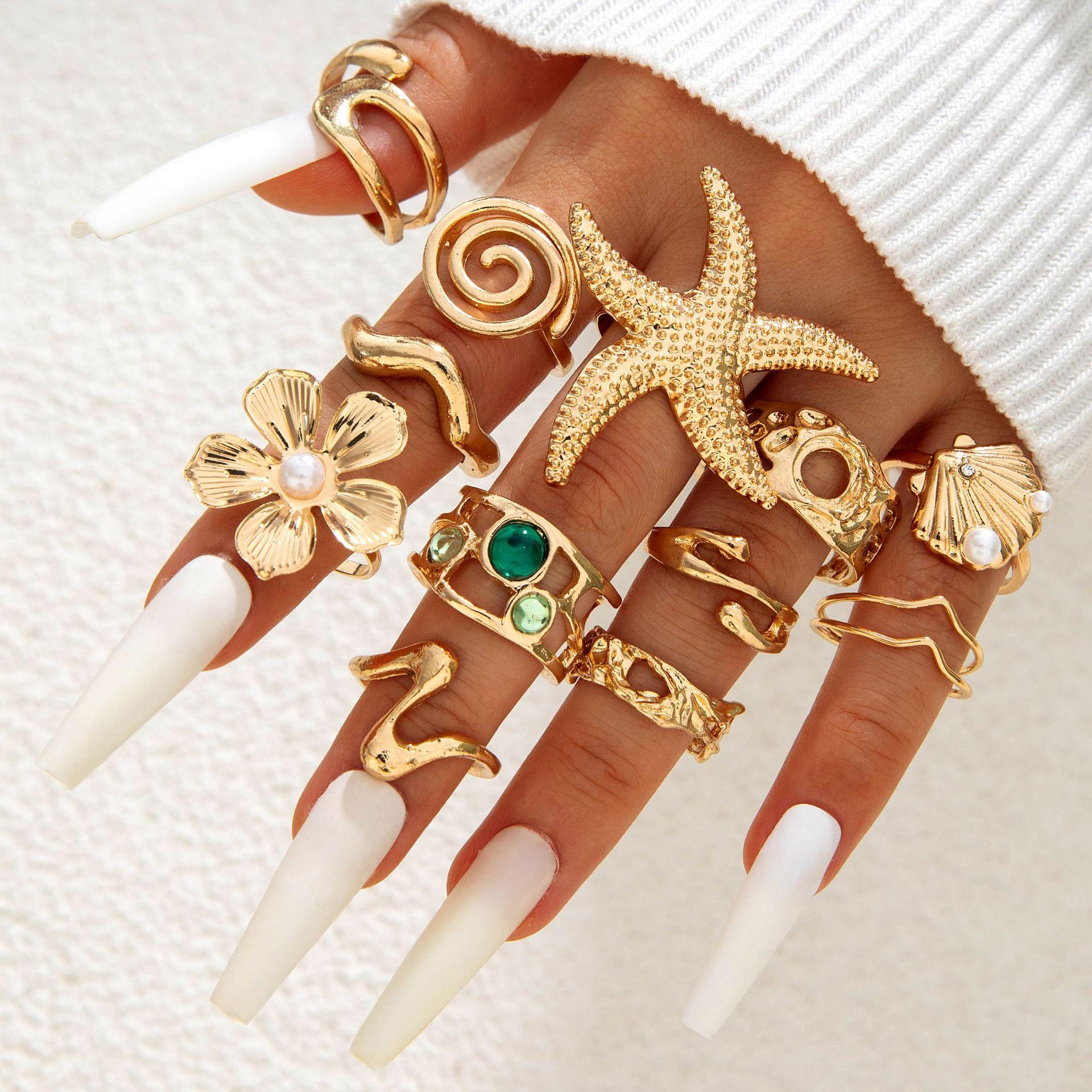 

European and American jewelry fashion irregular alloy cut-out winding imitation pearl flower layering ring set for women