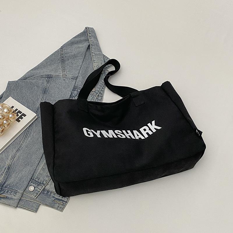 

Большая вместимость 2025 простой повседневный нишевый дизайн весенняя портативная студенческая сумка мужская и женская на плечо сумка-тоут чёрный