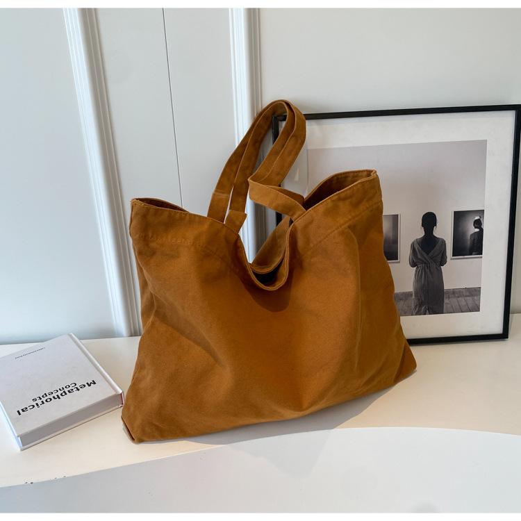 

New large-capacity tote bag, student class handbag, female Harajuku bag, fashionable and simple canvas shoulder bag. коричневый