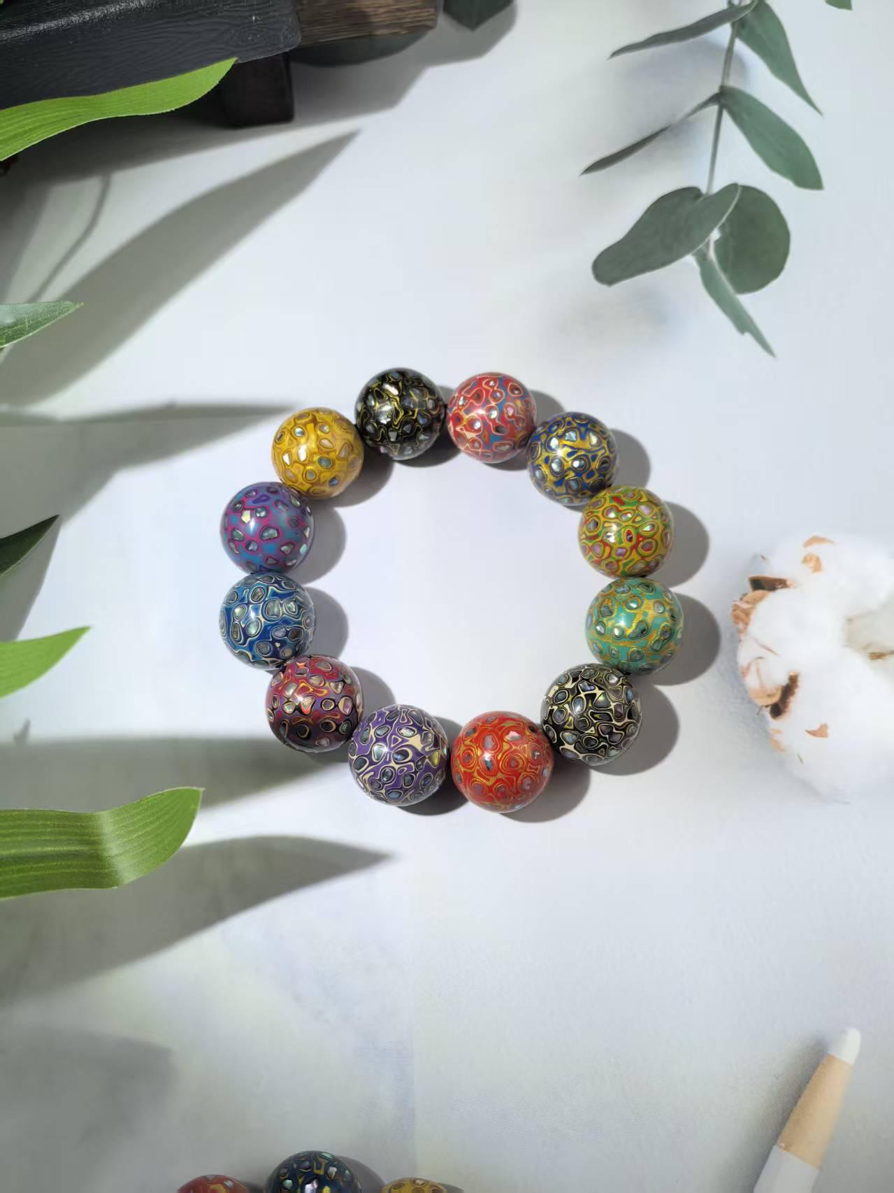 Mother-of-Pearl Lacquer Bead Bracelet with Multi-Treasure Buddhist Design