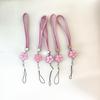 Camellia Four-Leaf Clover PU Leather Phone Wrist Lanyard with Nylon Woven Cord and Phone Case Pendant