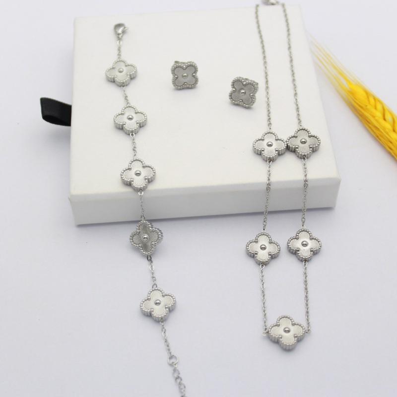 

Stylish Titanium Steel Minimalist and Elegant Floral Jewelry Set Four-leaf Clover Laser Bracelet Necklace and Earrings 18k