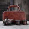 Yunnan handmade purple pottery full of industrial carving travel tea set, one pot and two cups, portable hand-held teapot, outdoor travel tea