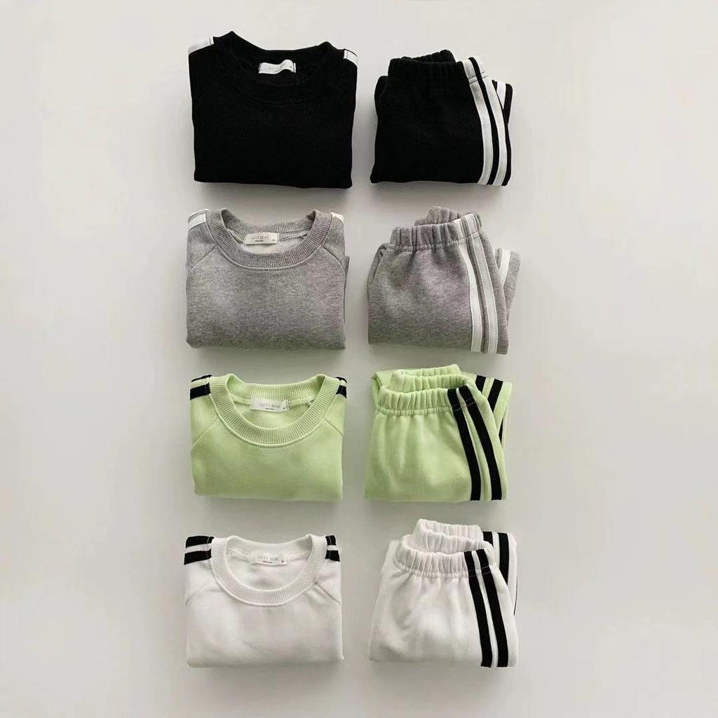 Korean-Style Unisex Baby Sweatshirt and Pants Set - Solid Color with Webbing Stripe Patchwork for Autumn and Spring.