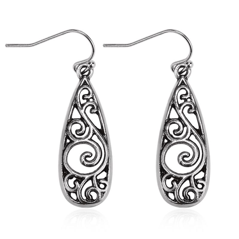 Retro Alloy Palace-Style Carved Floral Earrings for Women: Ethnic, Hollow Water Drop Design.