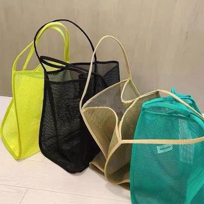 La borsa a tracolla in rete trasparente da 1 pezzo è una borsa per la spesa di grande capacità da viaggio leggera e alla moda