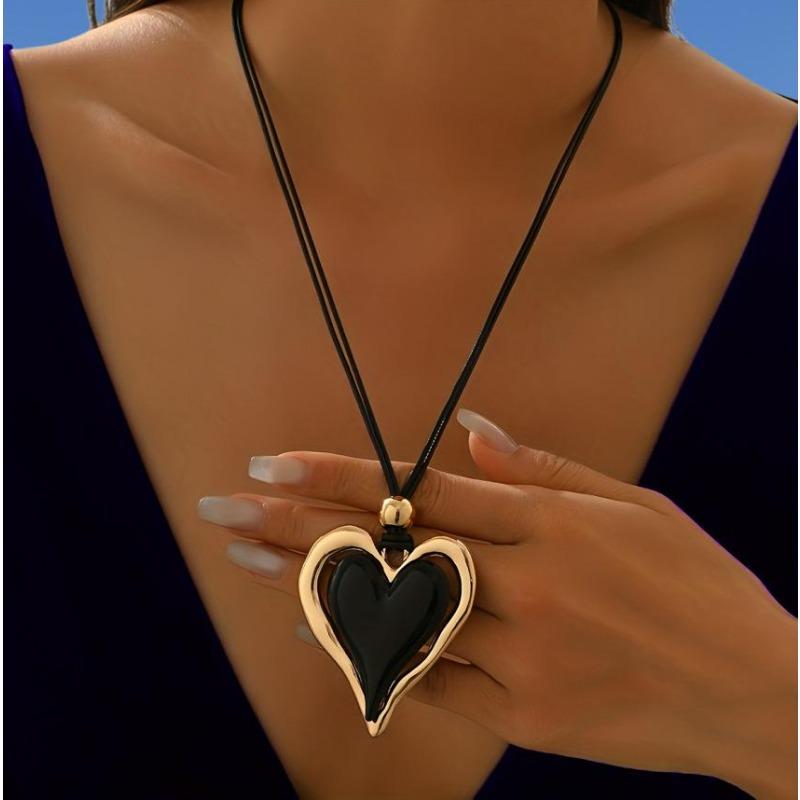 

Oversized black heart pendant with gold border gothpunk style exaggerated necklace