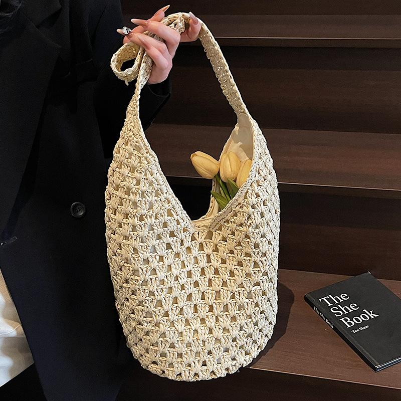 Neue hohle Stroh-Tragetasche Damen Strandurlaubsstil Lässige Schulter-Strandtasche Große Kapazität Stroh gewebte Tragetasche
