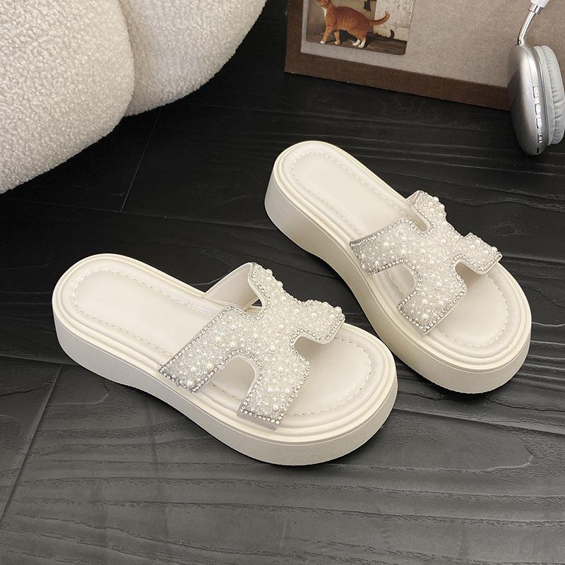 

Beautiful rhinestone cool slippers female summer wear 2025 new fairy wind thick bottom with skirt seaside beach one-word drag 40
