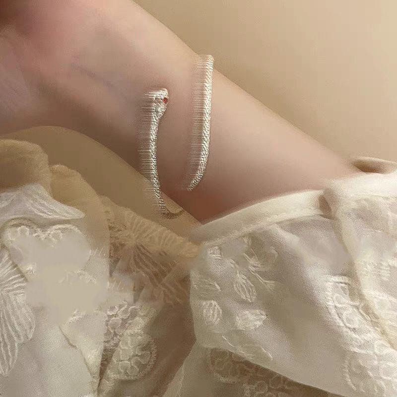 Silver Serpent Bangle: Minimalist Adjustable Design with Red-Eyed Detail - High-Quality Textured Bracelet