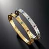 Pulseira de Aço Titânio com Olhos de Sol em Ouro 18K e Diamante - Joia Versátil de Aço Inoxidável para Mulheres