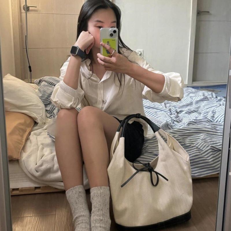 Nischen-Retro-Umhängetasche aus Canvas für Damen, neue einfache kleine Arbeitstasche, Unterarm-Pendeltasche