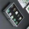 Boîte d'exposition multifonctionnelle pour montres et bijoux en alliage d'aluminium gris fumé avec couvercle transparent