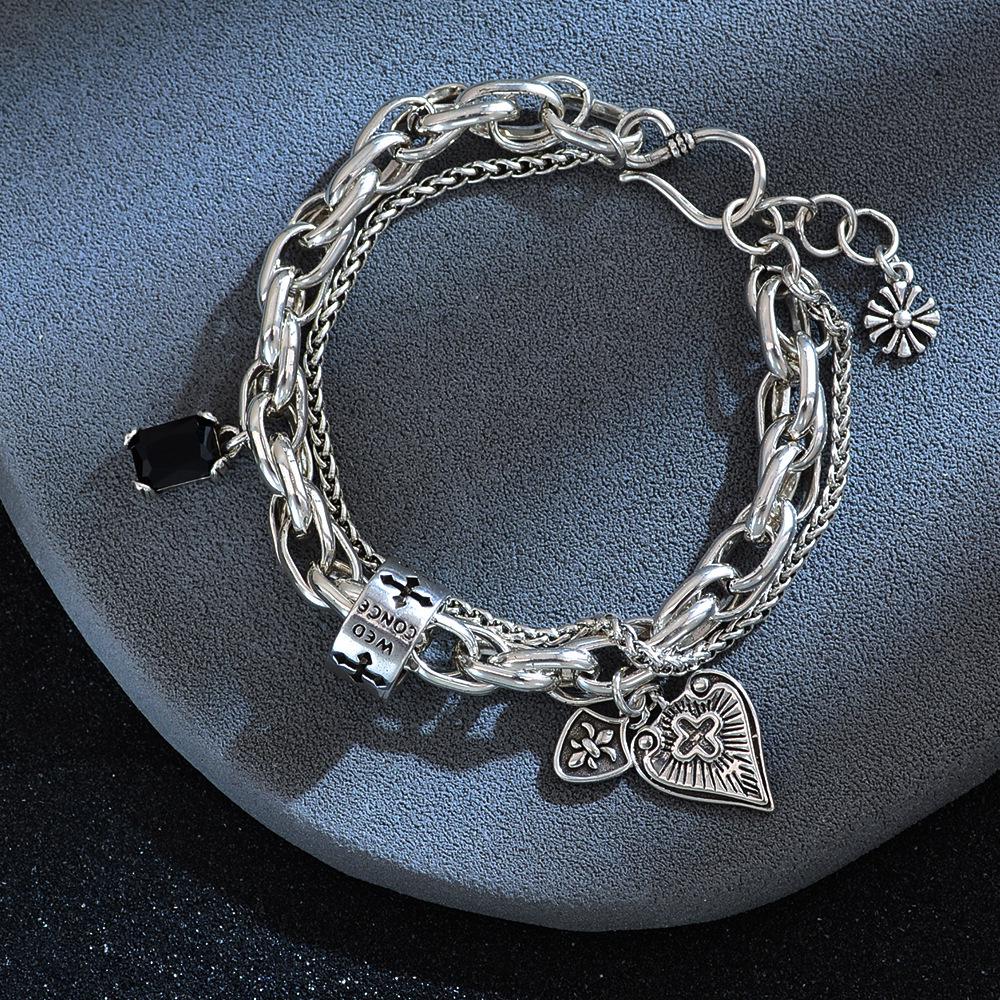 European & American Black Zircon Cross Bracelet: Retro Hip Hop Iris Flower Design for Women