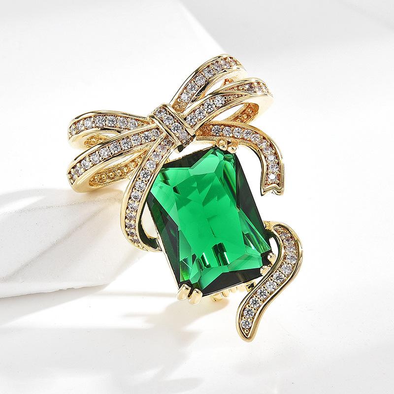 

Изумрудная брошь с бантом в европейском стиле, женская элитная легкая роскошная элегантная дворцовая индивидуальная нагрудная брошь с цветком, масляные аксессуары