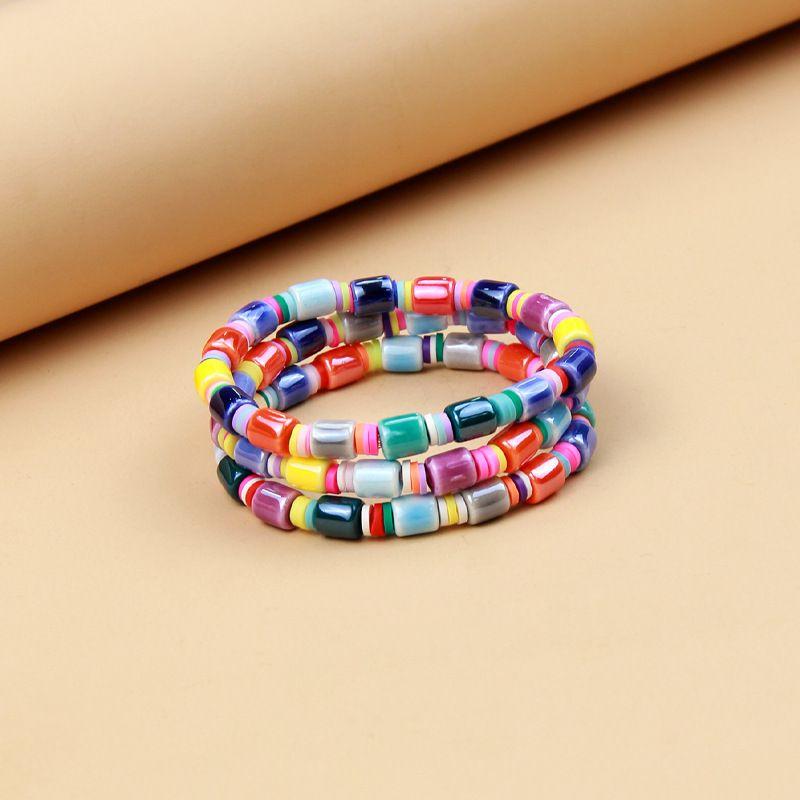 

Европейский и американский персонализированный трехслойный цветной керамический браслет с бусинами, женский, нишевый стиль, богемный стиль, радужный браслет, украшения, лето Three-layer Color ceramic bracelet