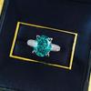Xiancan Jewelry S925 Silver Oval Paraiba Ice Flower Cut Ring with High Carbon Diamond.