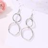 European & American Style Geometric Alloy Drop Earrings: Simple, Hollow, Round Design for Women.