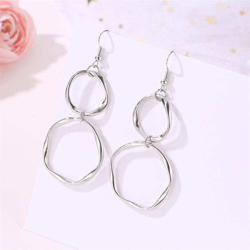 European & American Style Geometric Alloy Drop Earrings: Simple, Hollow, Round Design for Women.