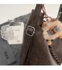Nische Retro 2025 Damen Schulter-Crossbody-Tasche mit großem Fassungsvermögen und Anhänger