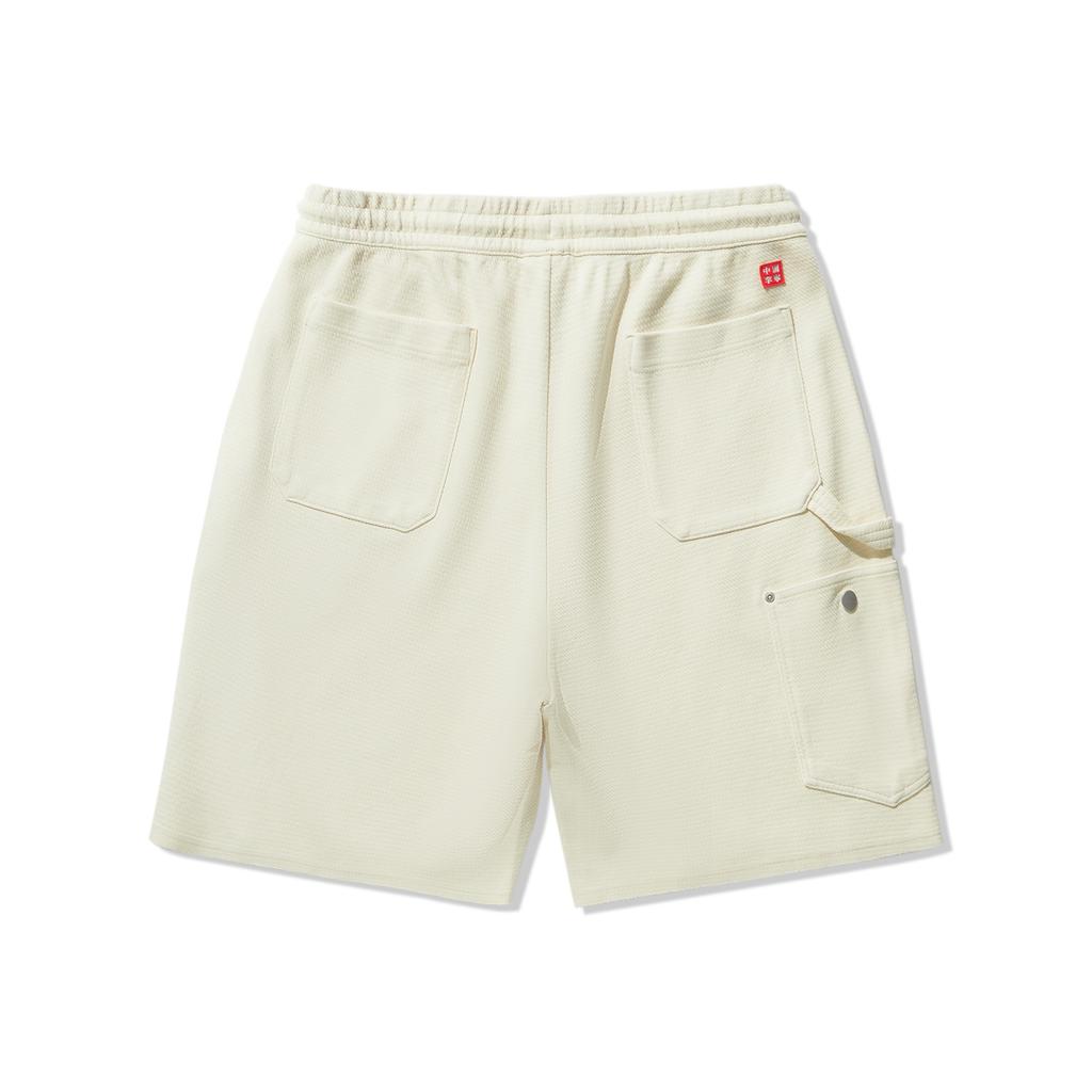 Li Ning Skateboard Series Lockerstrick Buchstaben Kordelzug Lässige Shorts Herrenshorts Gelato-Gelb AKSU817-2