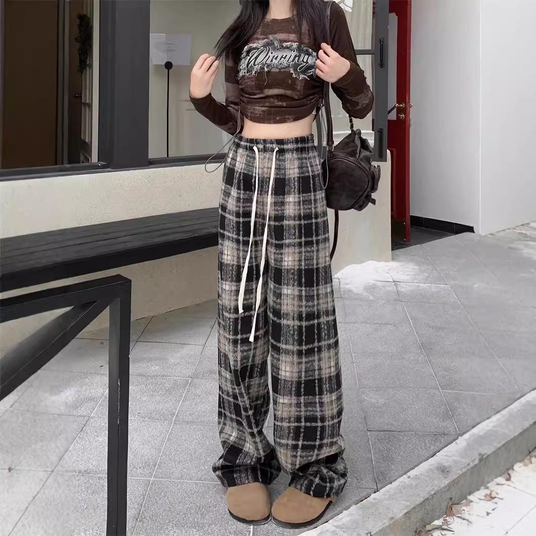 

Жіночі штани в клітинку з еластичною талією та широкими штанинами - легкі, на шнурку, повсякденні, ідеально підходять для весни та осені. Medium