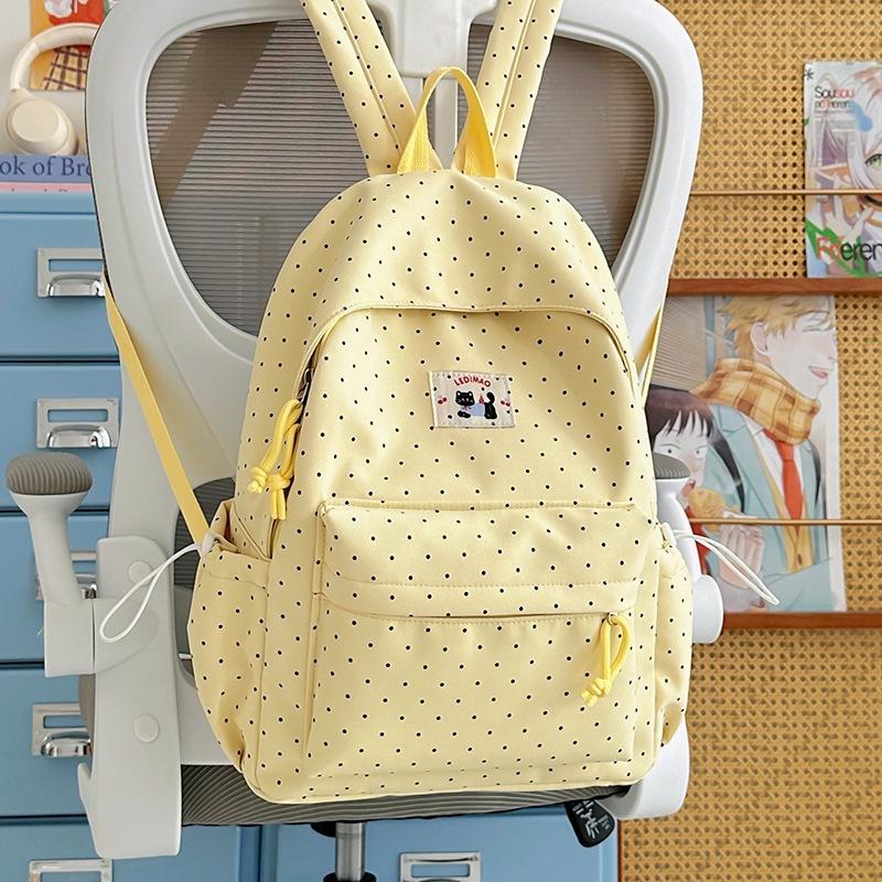 School bag: new elementary school backpack, girls' middle school students, high aesthetic value, INS style, niche, cute polka dot lightweight backpack