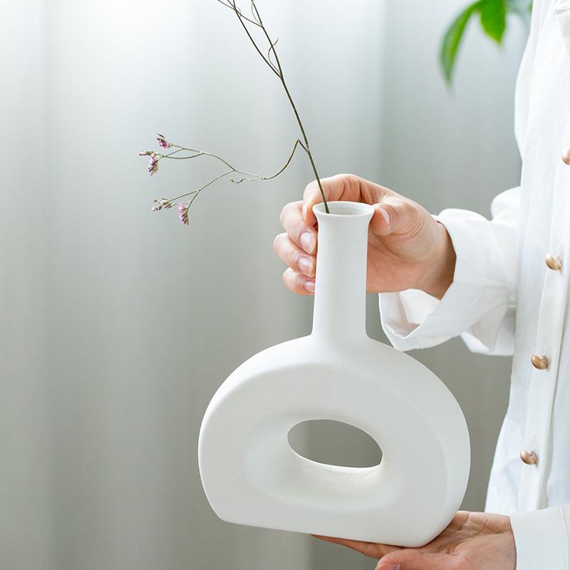 White Ceramic Vase with Dried Baby's Breath for Living Room or Dining Table Decoration