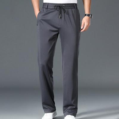 Men Stretchy Casual Pants with Pockets Drawstring Design Solid Color Fast Dry Trousers Full Length Straight Pants