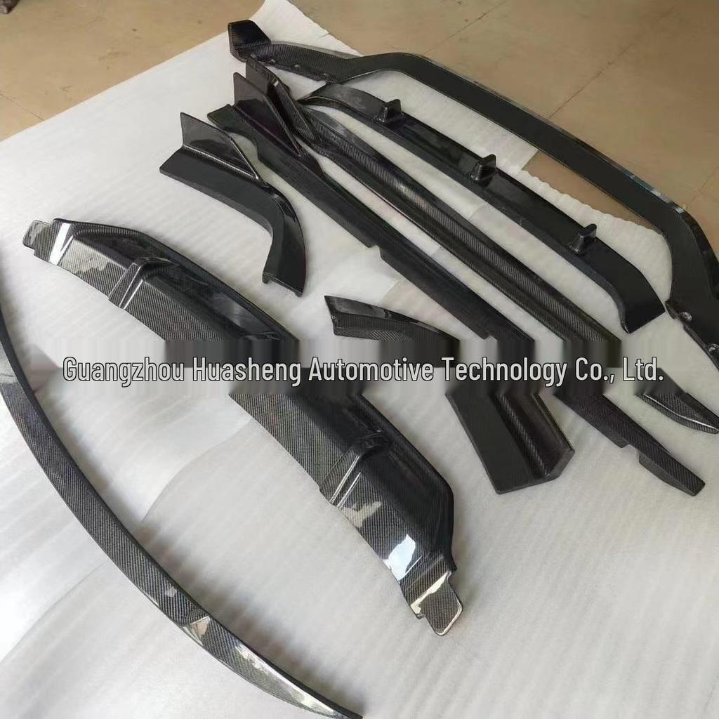 BMW X5 G05 Carbon Fiber Black Warrior Kit: Head Shovel, Front Lip, Side Skirts, Rear Wing, and Corner Spats.