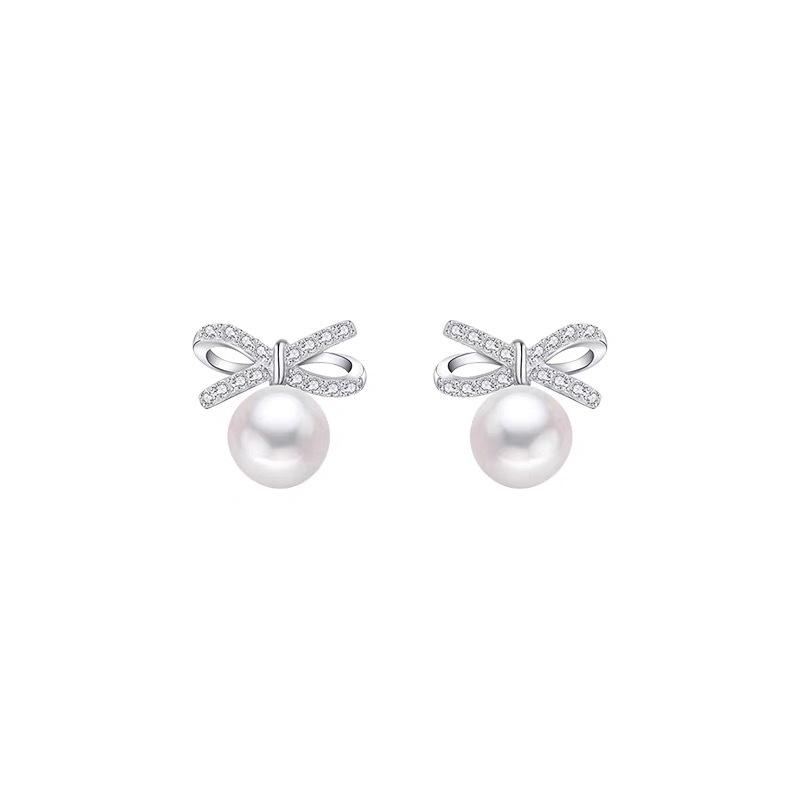 

Elegant Pearl Bow Earrings: Simple, Versatile, and Exquisite Design for Women