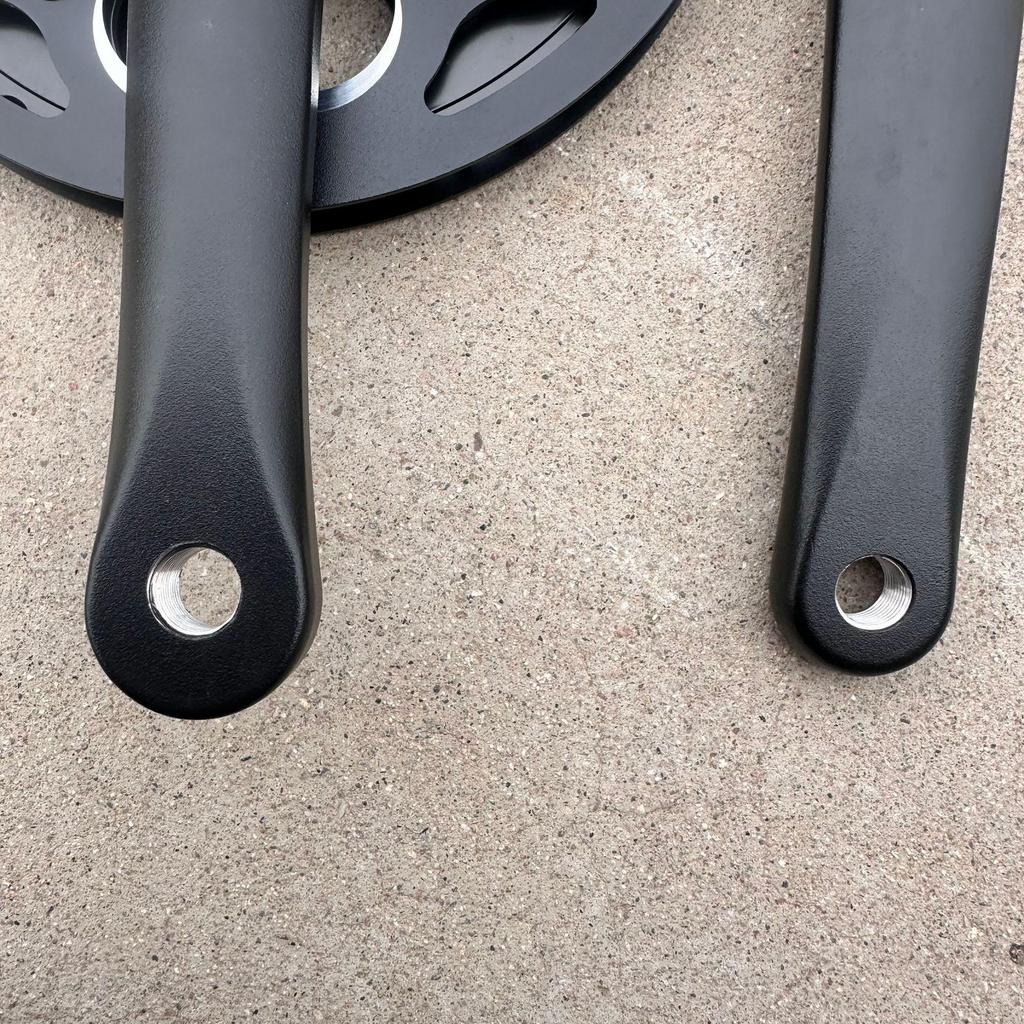 Compact Folding Road Bike with 46-Tooth Single-Piece Crankset and Double Chainring Guard