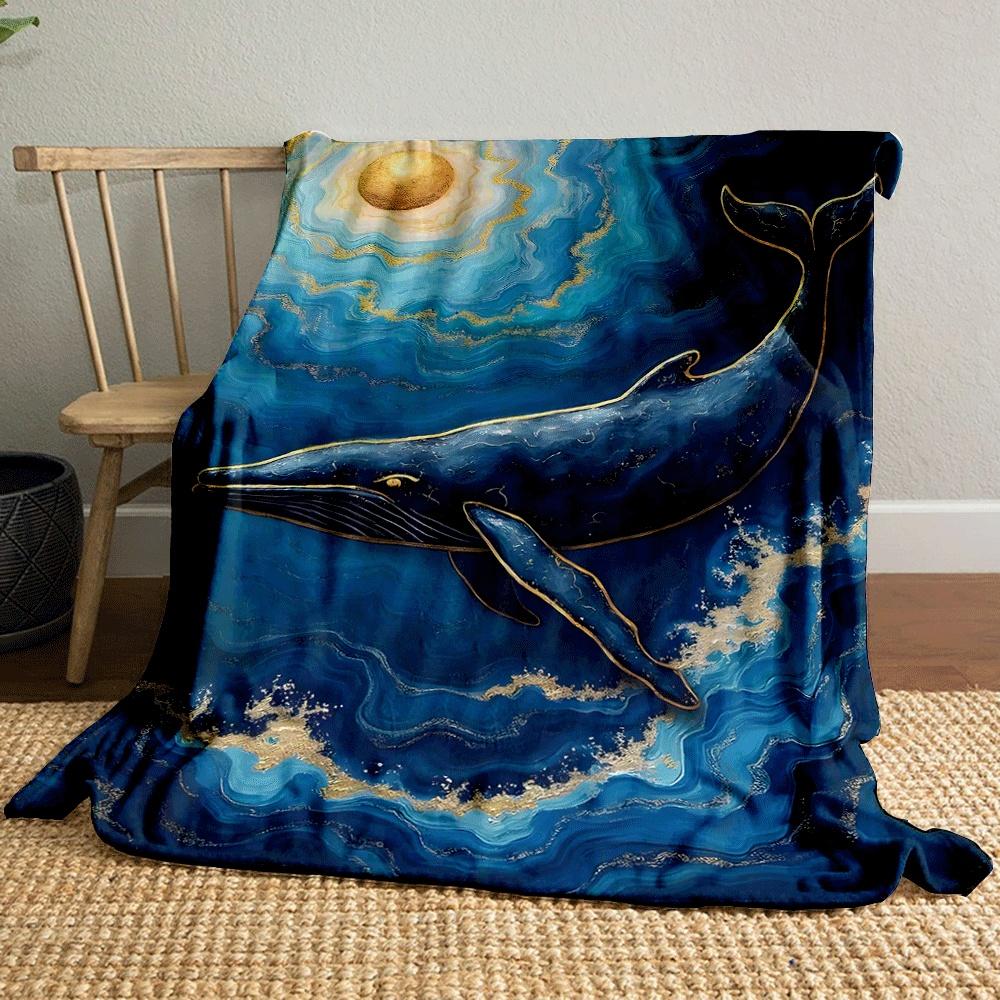 A golden-accented whale swimming in swirling blue waves under a gold sun. for all seasons blanket lunch break throw gift