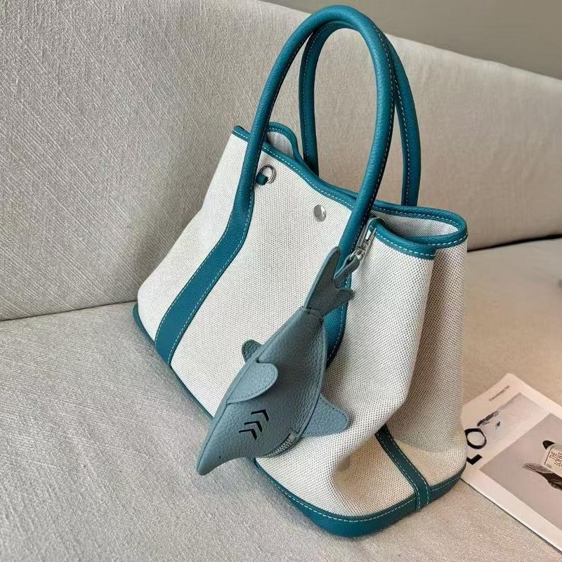 New leather dolphin change bag, keychain pendant, cute fashion earphones, lipstick storage bag.