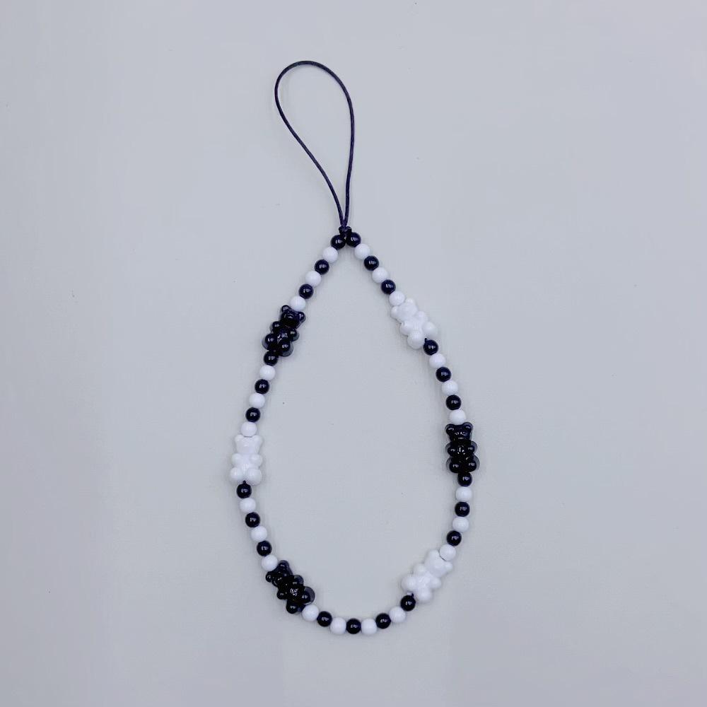 

The same Xiaohongshu INS style in Japan and South Korea is cute, black and white bear acrylic beads are fashionable, anti-lost, hand-held pendant