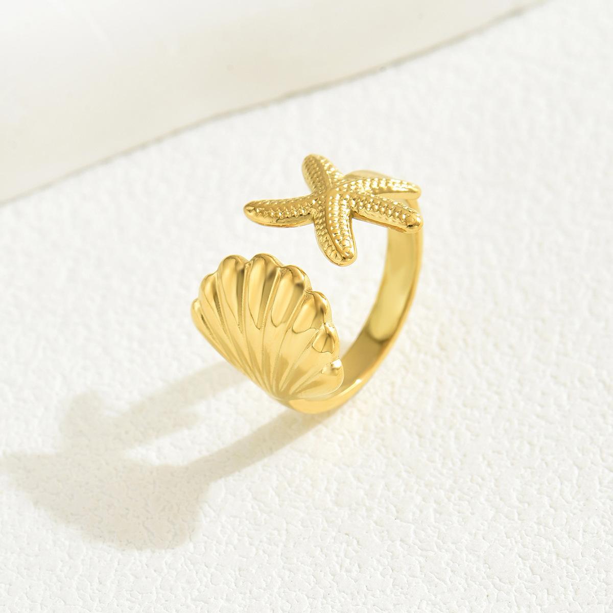 

Женское универсальное кольцо в морском стиле с ракушкой и морской звездой one size