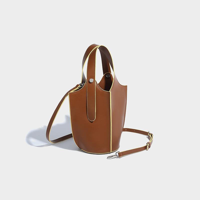 

Niche vegetable basket bucket female 2024 new trend star same fruit basket high-end sense portable messenger bag коричневий