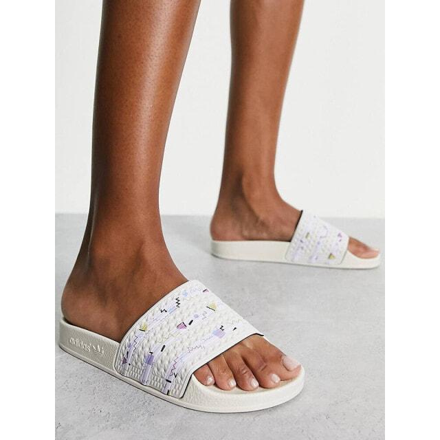 

adidas Originals Adilette sliders in off white with printed stripes