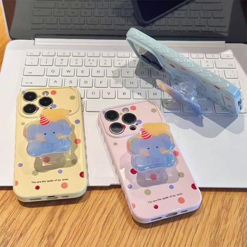 Anwendbar auf iPhone17ProMax neue Cartoon-Handyhülle, farbiger Punkt-Baby-Elefant-Halter, Apple 16 weiche Hülle 14.
