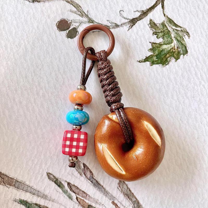 

Брелок для мобильного телефона в виде бейгла ручной работы - Аксессуар в стиле INS, легкая роскошь, капля