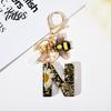 Talos Black Series Keychain Pendant, Dried Flower Initial Letter Charm Key Chain with Bee Tassel Design, A-Z Holder for Bag Purse Backpack
