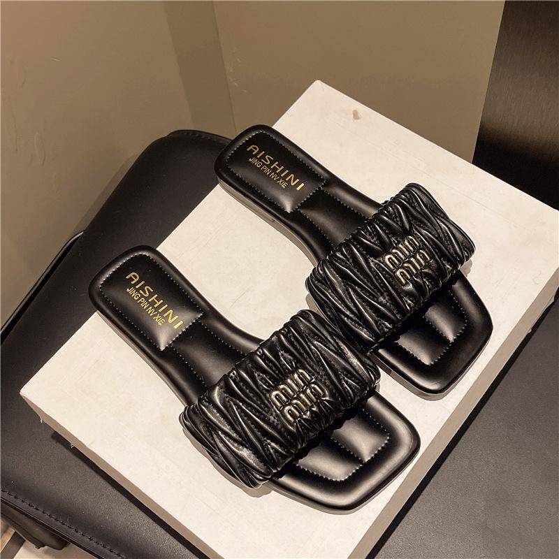 

Тапочки женские летние 2025 новые на плоской подошве с французскими складками повседневные пляжные крутые тапочки фея ветер на перемычке 40 чёрный