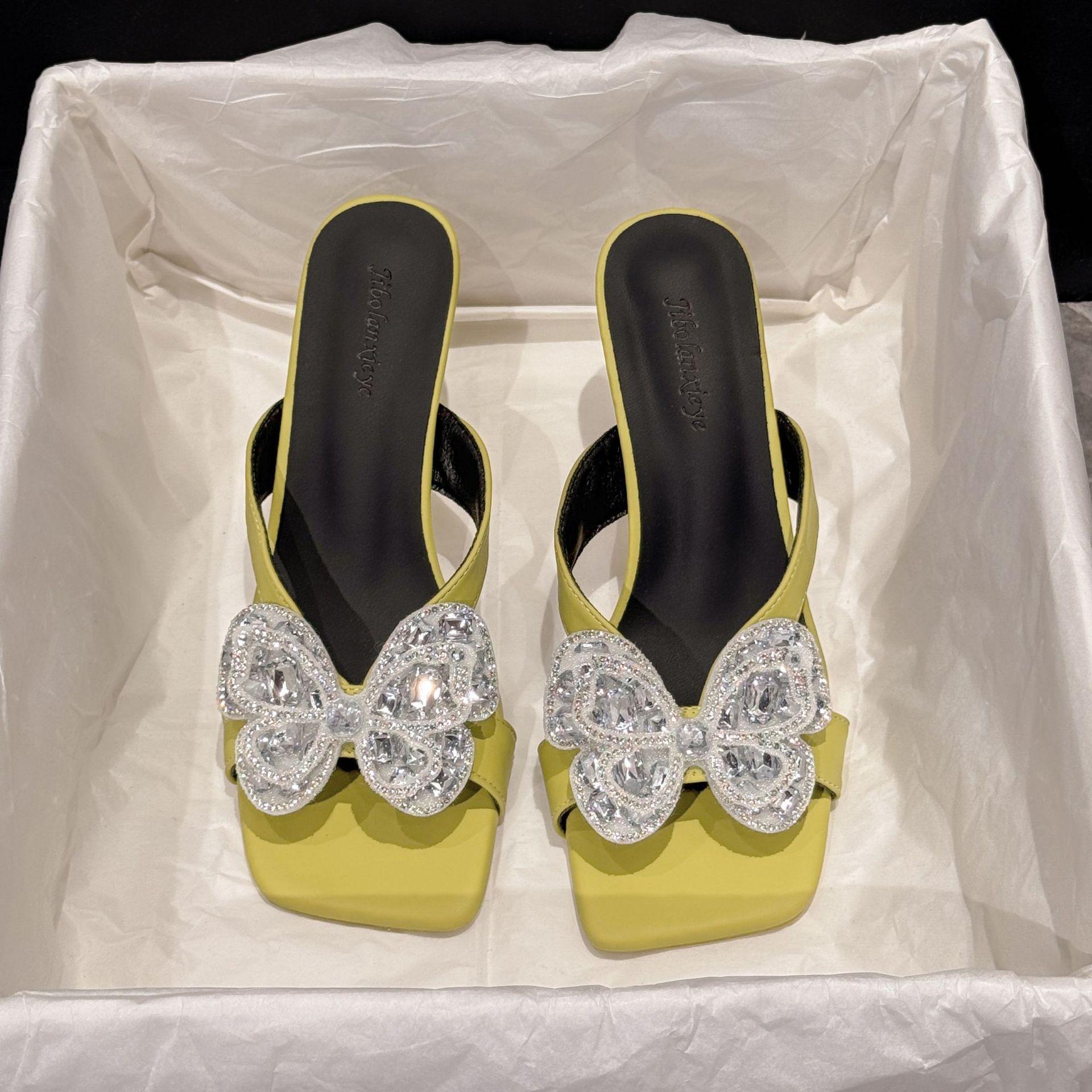 

Summer new butterfly rhinestone temperament versatile square head thick heel low heel one-word drag 35