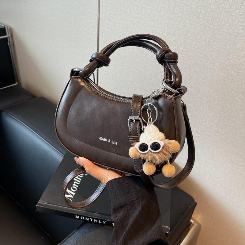 

Retro portable saddle bag women s fashion new fashion niche design bag high-end versatile shoulder messenger bag темно-коричневого