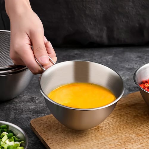Stainless steel colander and bowl set with handles, perfect for draining rice and other dishes. Also includes a colander and bowl. Perfect for fruit,