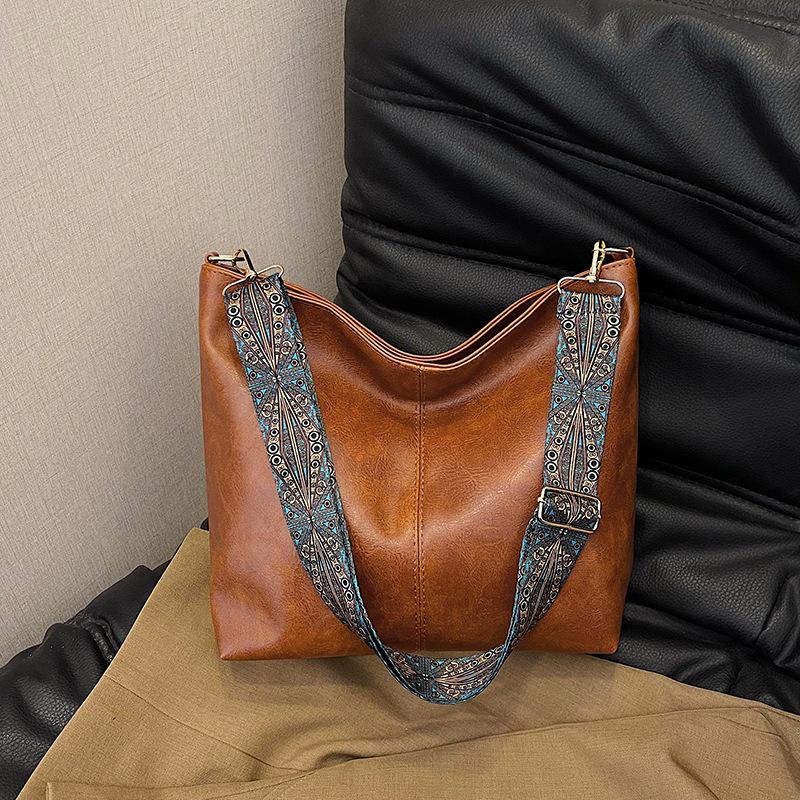 2025 Retro Shoulder Bags: Women's Large Capacity Wide-Band Messenger Bags - Spring/Summer Advanced Texture Bucket Design.